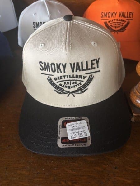Cream and black structured cap embroidered with the Smoky Valley Distillery crest