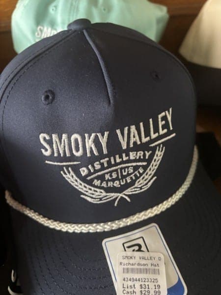 Navy rope-front cap with cream Smoky Valley Distillery embroidery