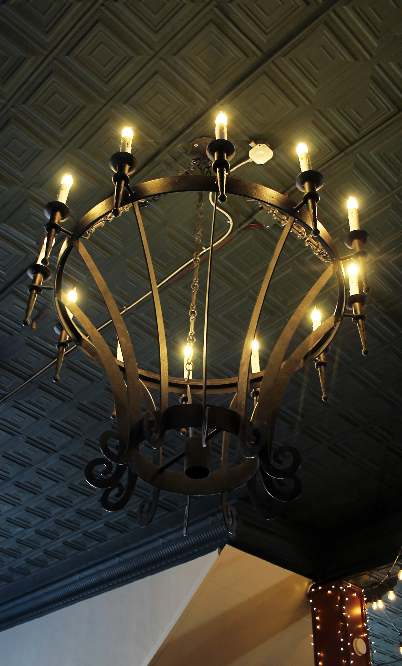 Wrought iron chandelier in the event space at Smoky Valley Distillery