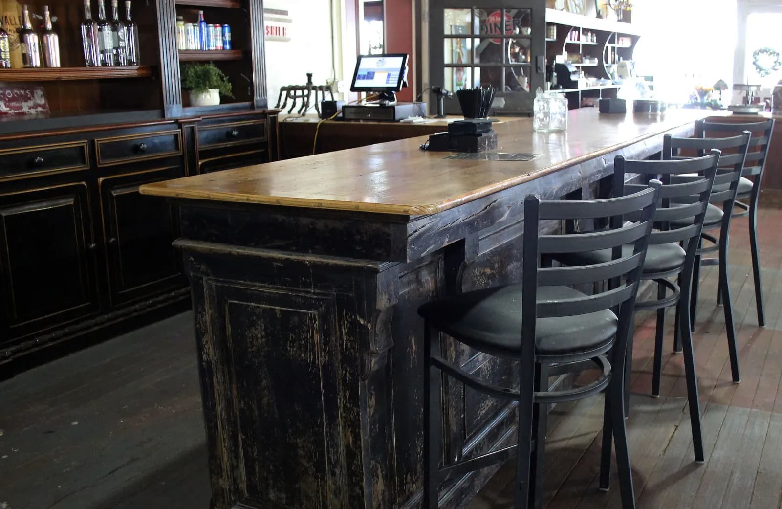 Bar counter and stools at Smoky Valley Distillery
